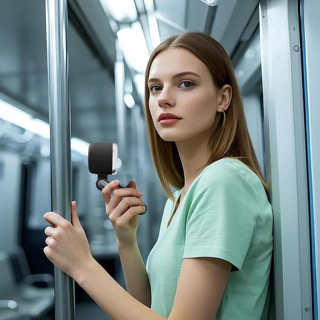Professional using KAVIUR Air handheld fan while travelling